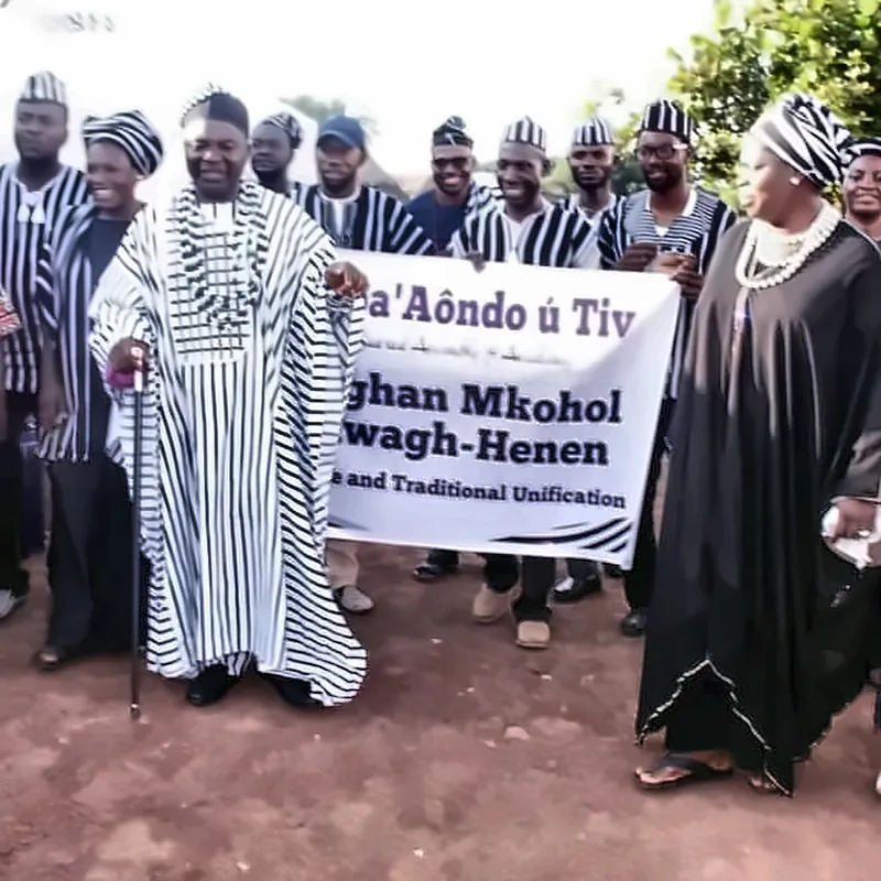 Elders in A’nger robes with staffs stand before the unification banner